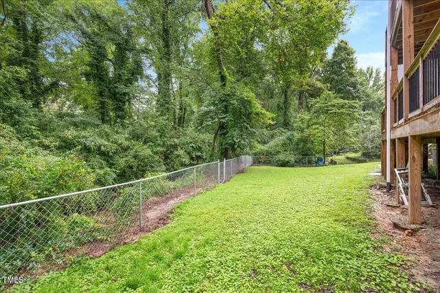a view of a yard with a large trees