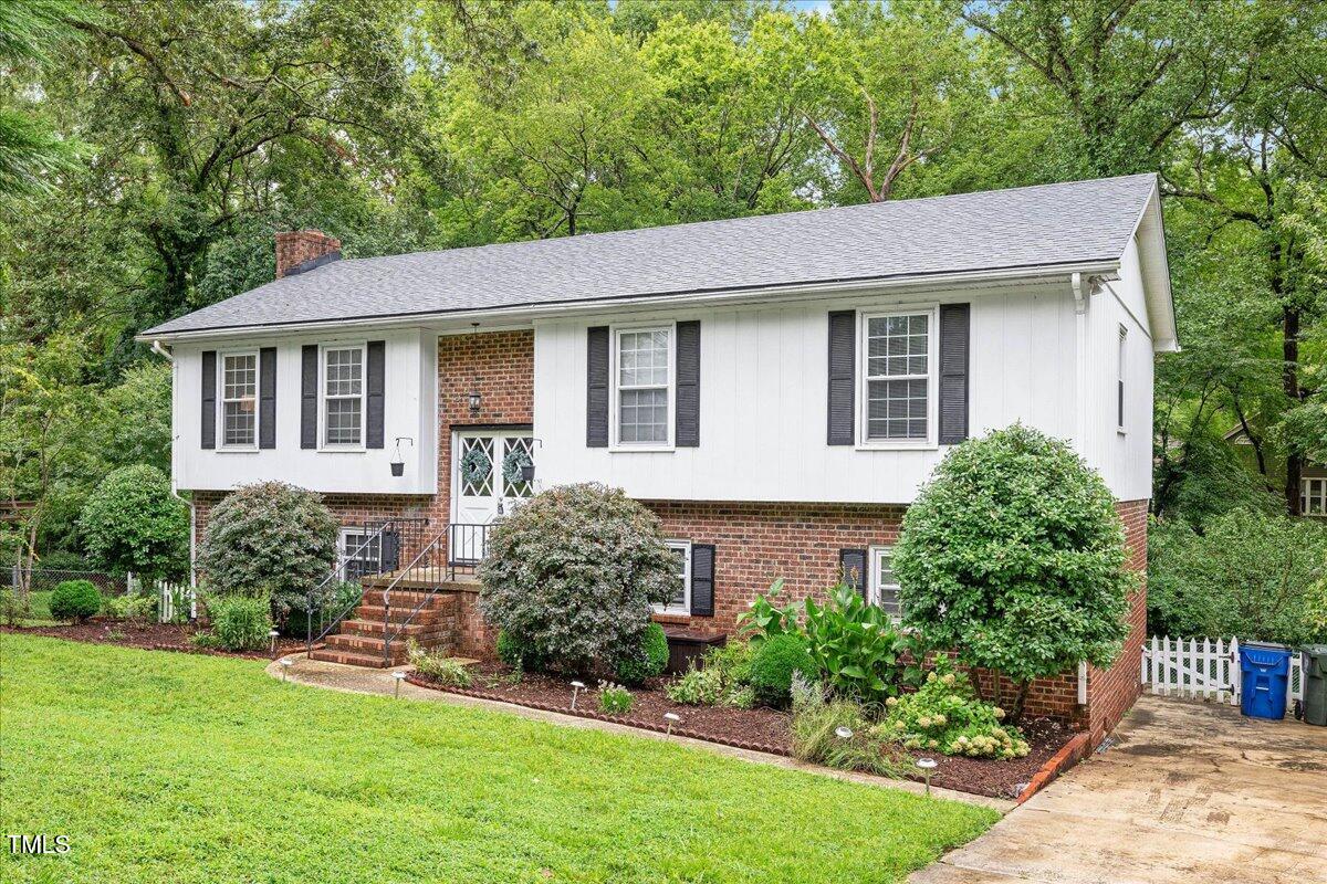 5812 Old Forge Circle Raleigh, NC 27609 - Photo 31 of 31 a front view of a house with a yard