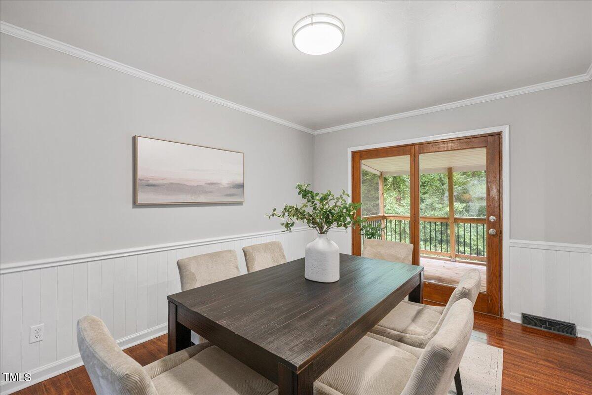 5812 Old Forge Circle Raleigh, NC 27609 - Photo 7 of 31 a view of a dining room with furniture window and wooden floor