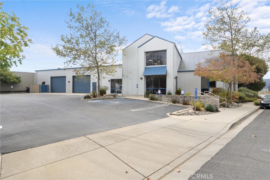 a view of a white house with a outdoor space