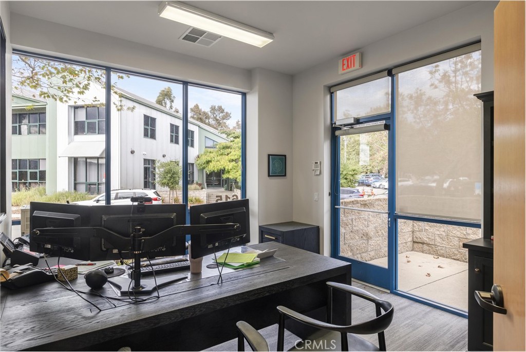 615 Clarion Court San Luis Obispo, CA 93401 - Photo 13 of 39 a room with a large window and wooden floor
