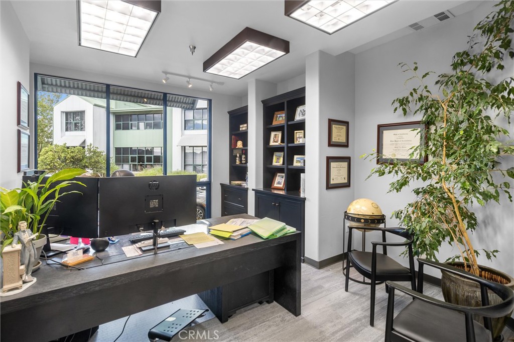 615 Clarion Court San Luis Obispo, CA 93401 - Photo 19 of 39 a view of a workspace with furniture and a potted plant
