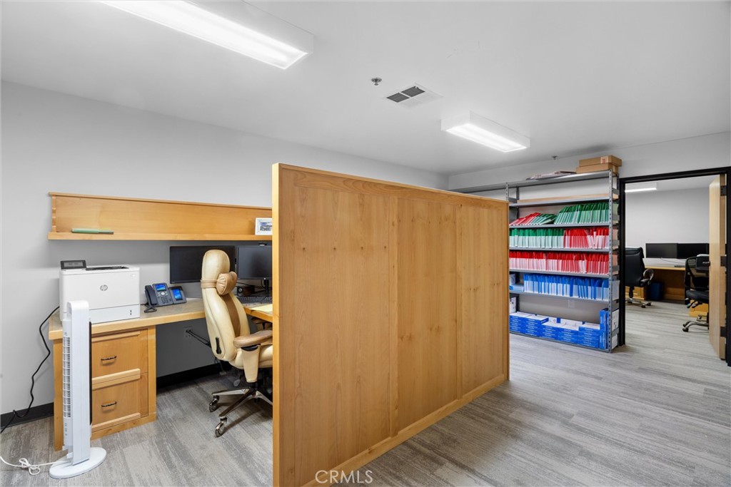 615 Clarion Court San Luis Obispo, CA 93401 - Photo 21 of 39 a view of a room with workspace and wooden floor