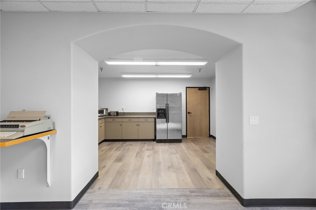 615 Clarion Court San Luis Obispo, CA 93401 - Photo 22 of 39 a view of a kitchen with a sink refrigerator and wooden floor