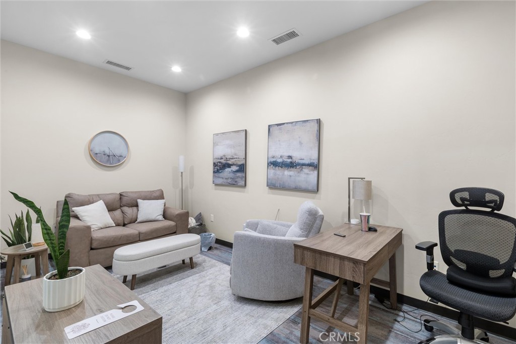 615 Clarion Court San Luis Obispo, CA 93401 - Photo 23 of 39 a living room with furniture and wooden floor