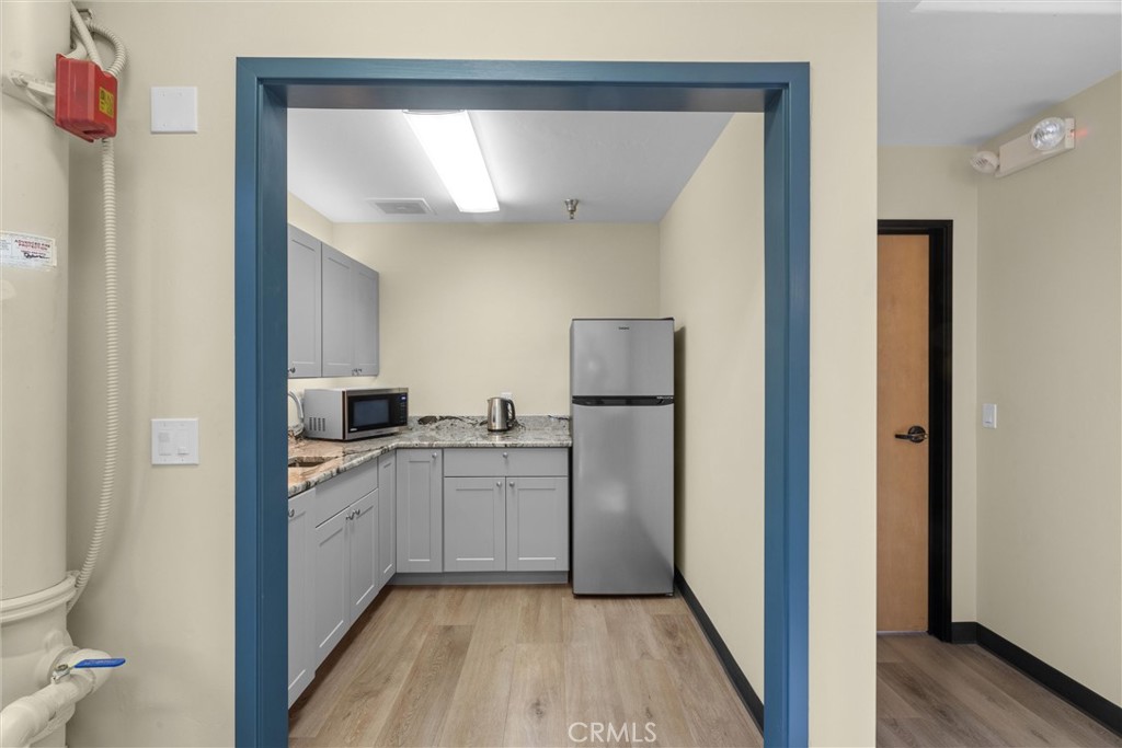 615 Clarion Court San Luis Obispo, CA 93401 - Photo 26 of 39 a kitchen with white cabinets and white appliances