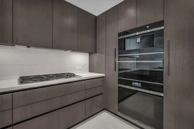 a view of a dining room with furniture and a flat screen tv