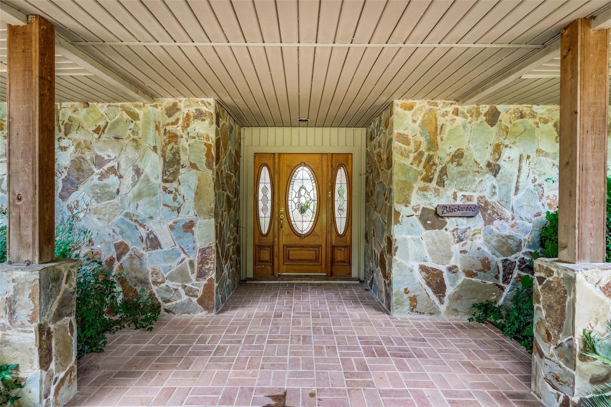 19410 Nehoc Lane Houston, TX 77346 - Photo 17 of 26 a front view of a house with garden