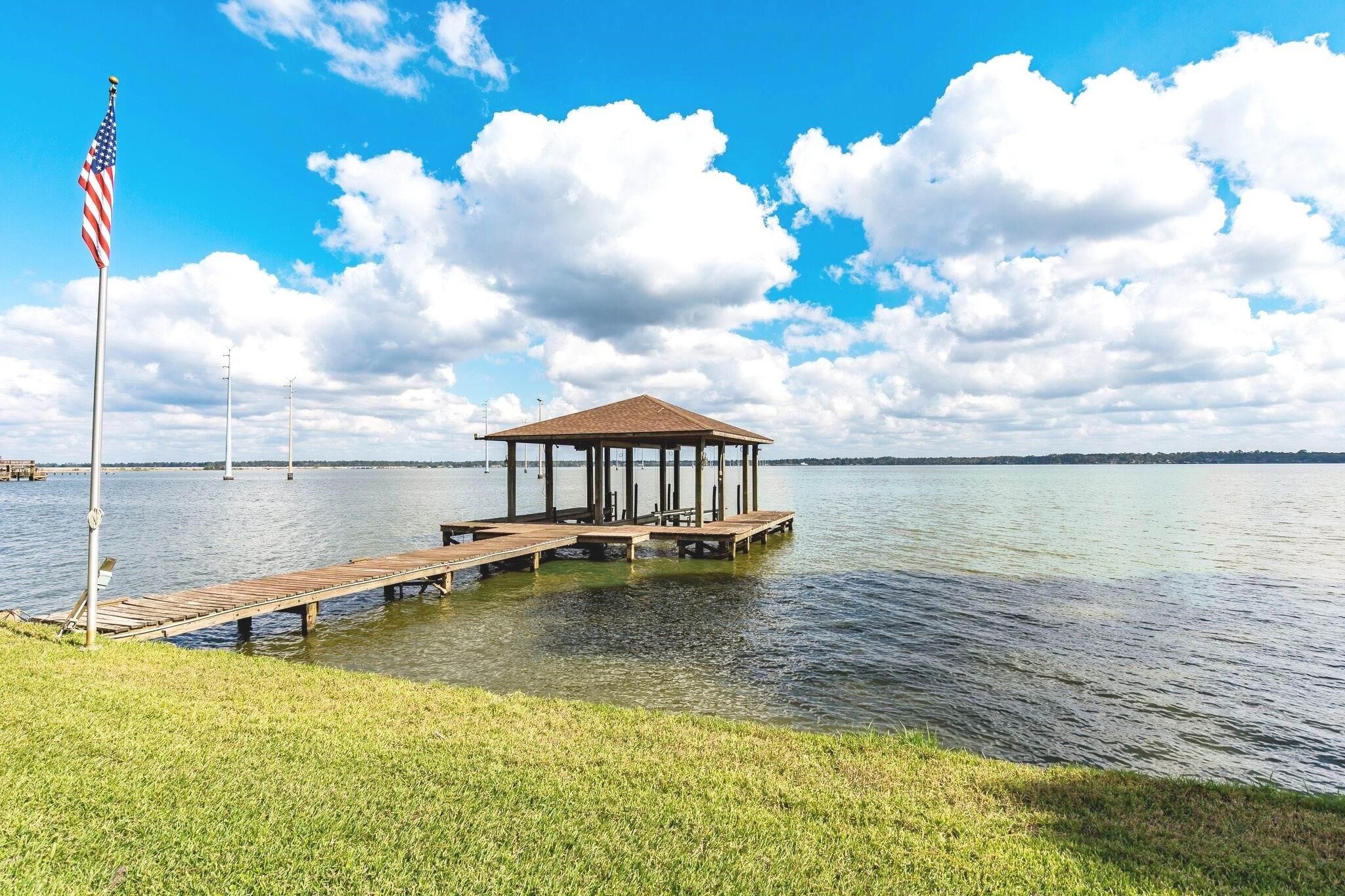 19410 Nehoc Lane Houston, TX 77346 - Photo 26 of 26 a view of a lake with a big yard