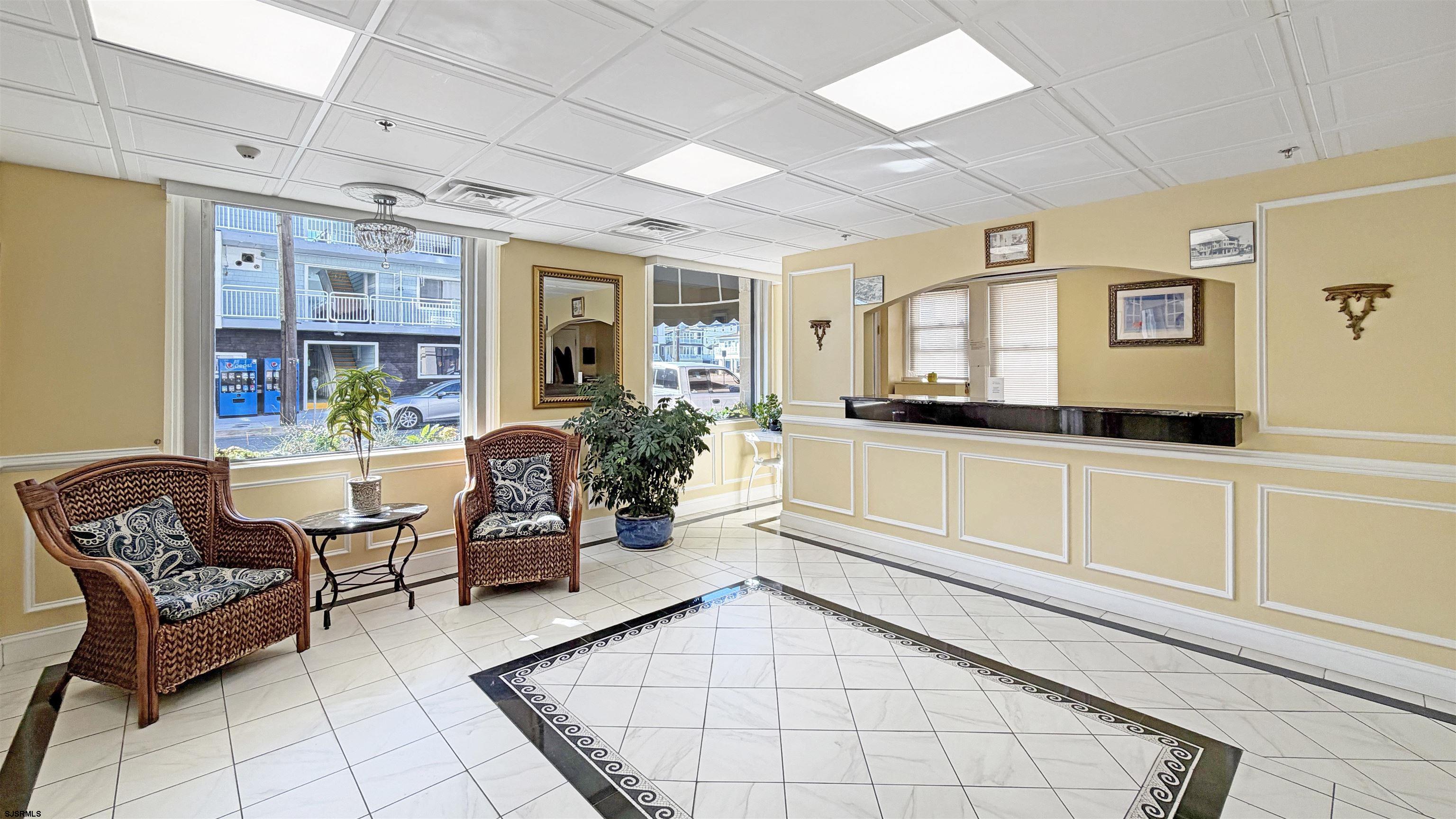 807 East 8th Street, Unit 511 Ocean City, NJ 08226 - Photo 11 of 12 a living room with furniture and flat screen tv