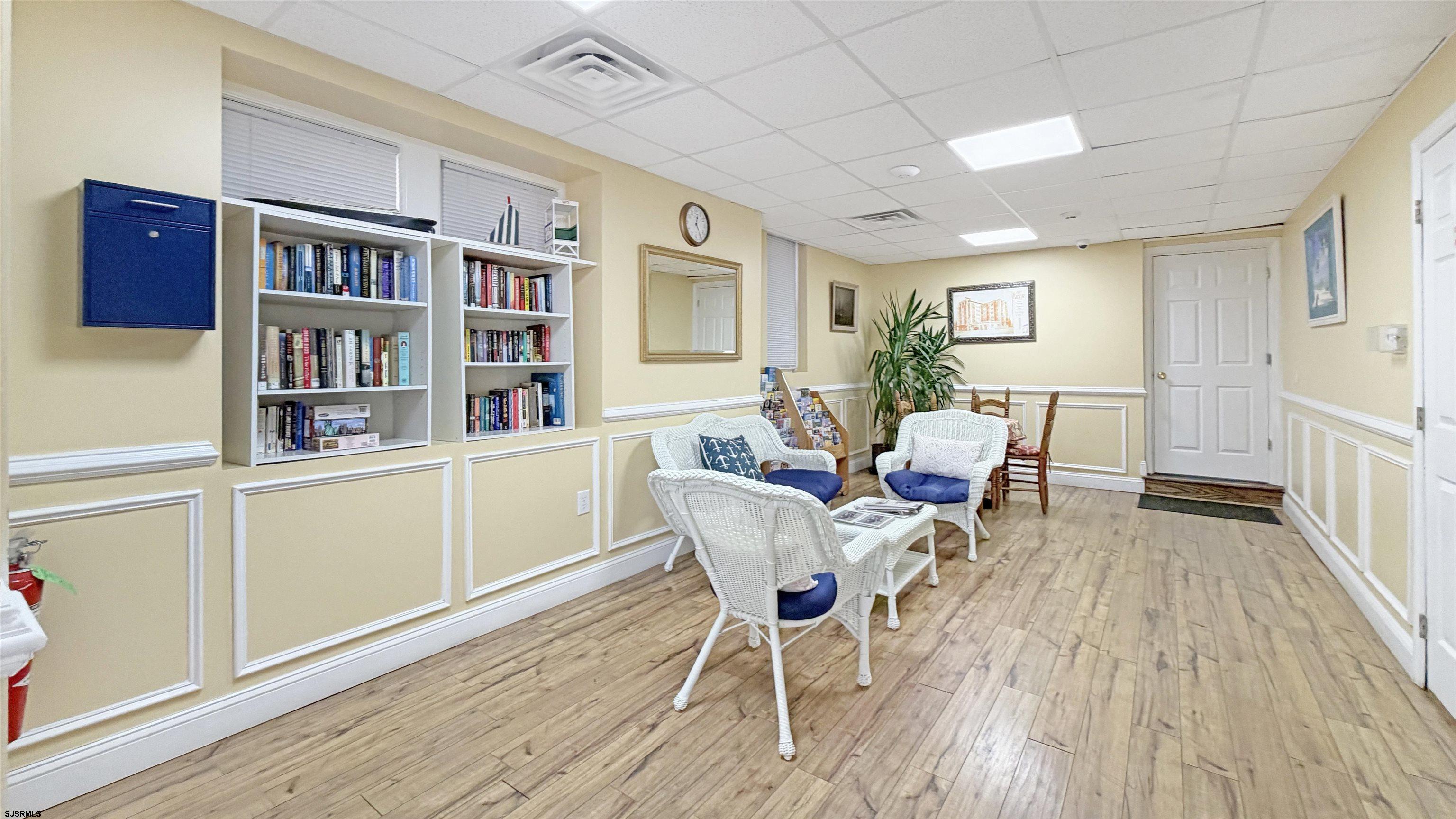 807 East 8th Street, Unit 511 Ocean City, NJ 08226 - Photo 12 of 12 a living room with furniture and a wooden floor
