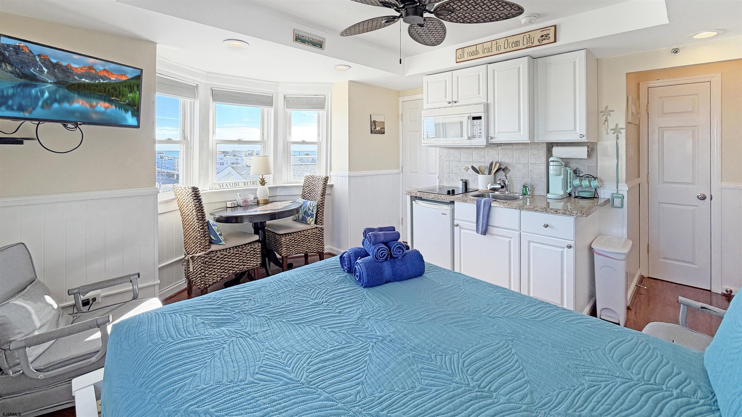 807 East 8th Street, Unit 511 Ocean City, NJ 08226 - Photo 5 of 12 a kitchen with a sink cabinets and window