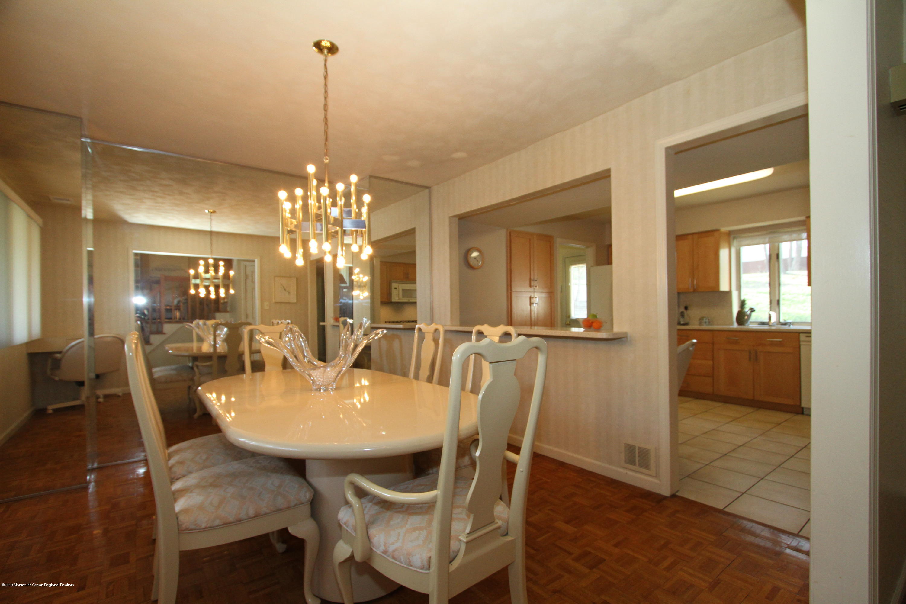 3 Floyd Wyckoff Road Morganville, NJ 07751 - Photo 11 of 28 a view of a dining room with furniture and chandelier