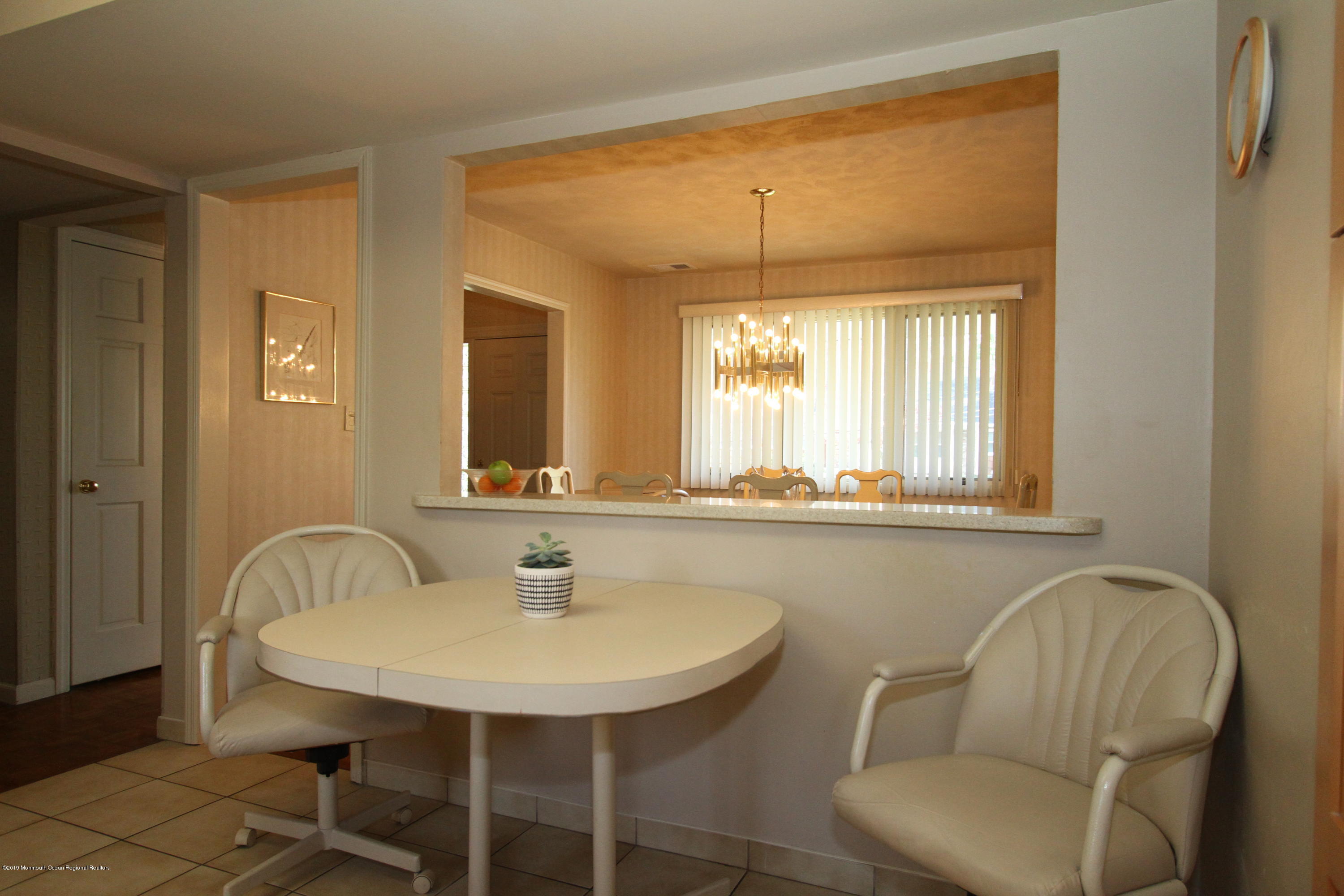 3 Floyd Wyckoff Road Morganville, NJ 07751 - Photo 14 of 28 a bathroom with a sink a mirror and a bathtub