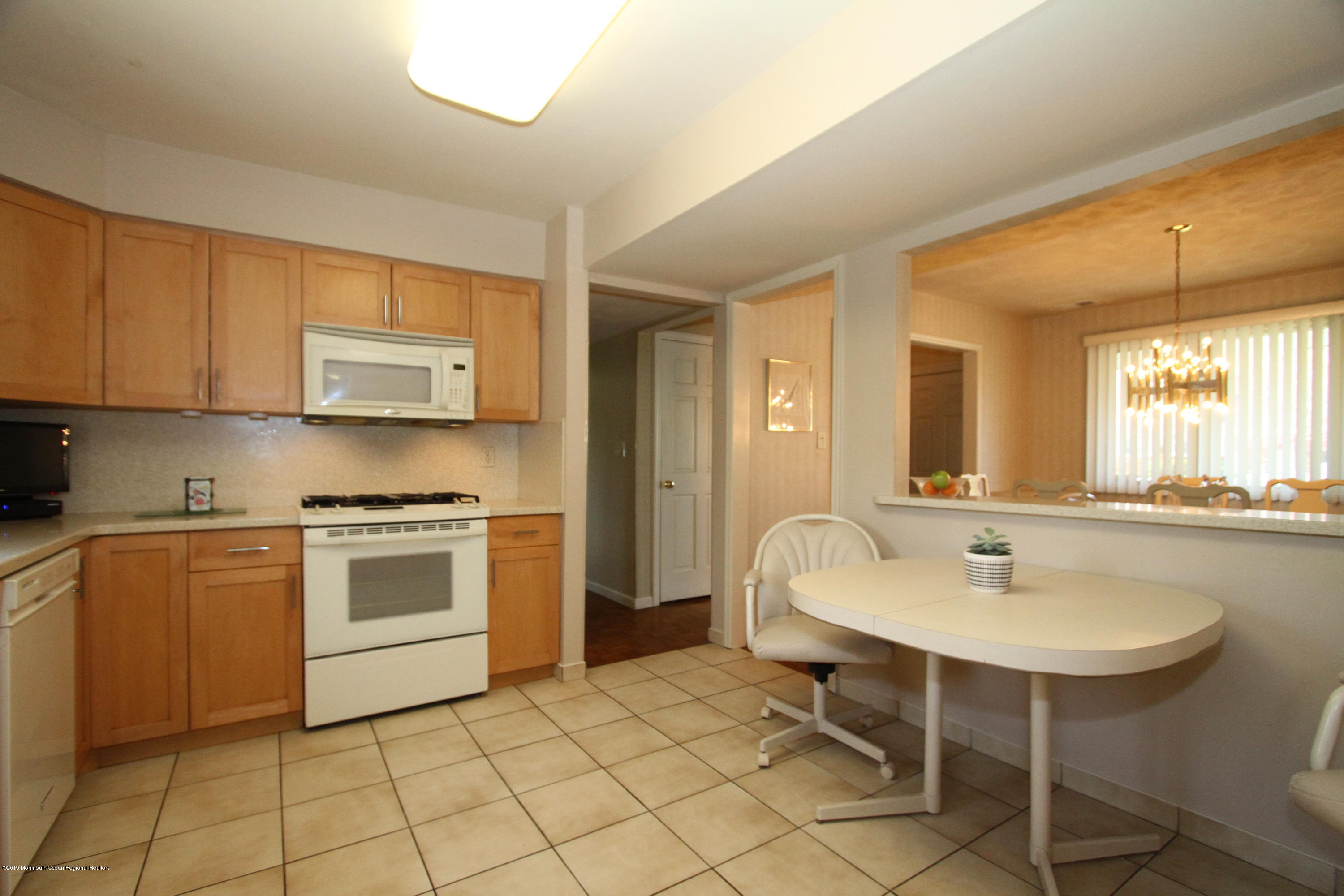 3 Floyd Wyckoff Road Morganville, NJ 07751 - Photo 15 of 28 a kitchen with a sink cabinets and appliances