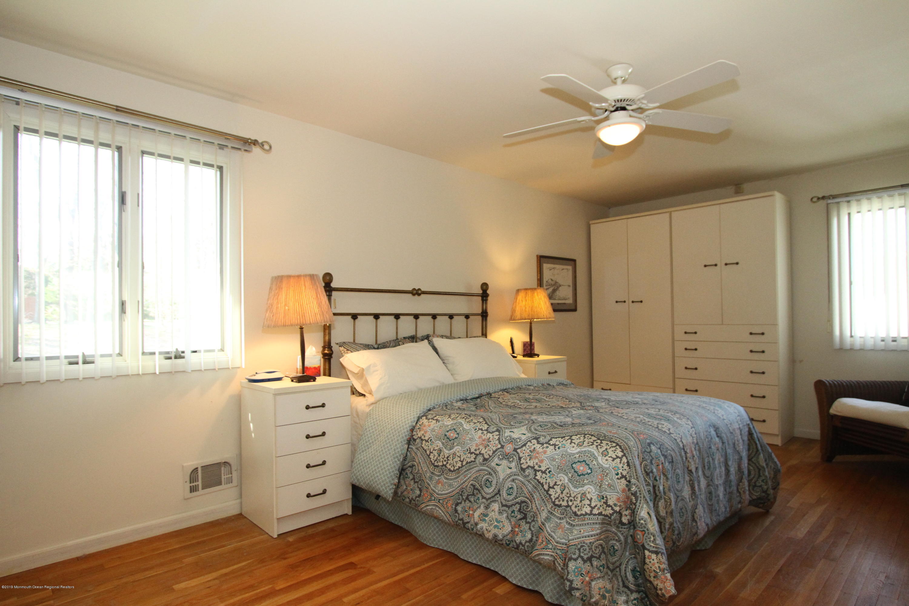 3 Floyd Wyckoff Road Morganville, NJ 07751 - Photo 16 of 28 a bedroom with a large bed and a window