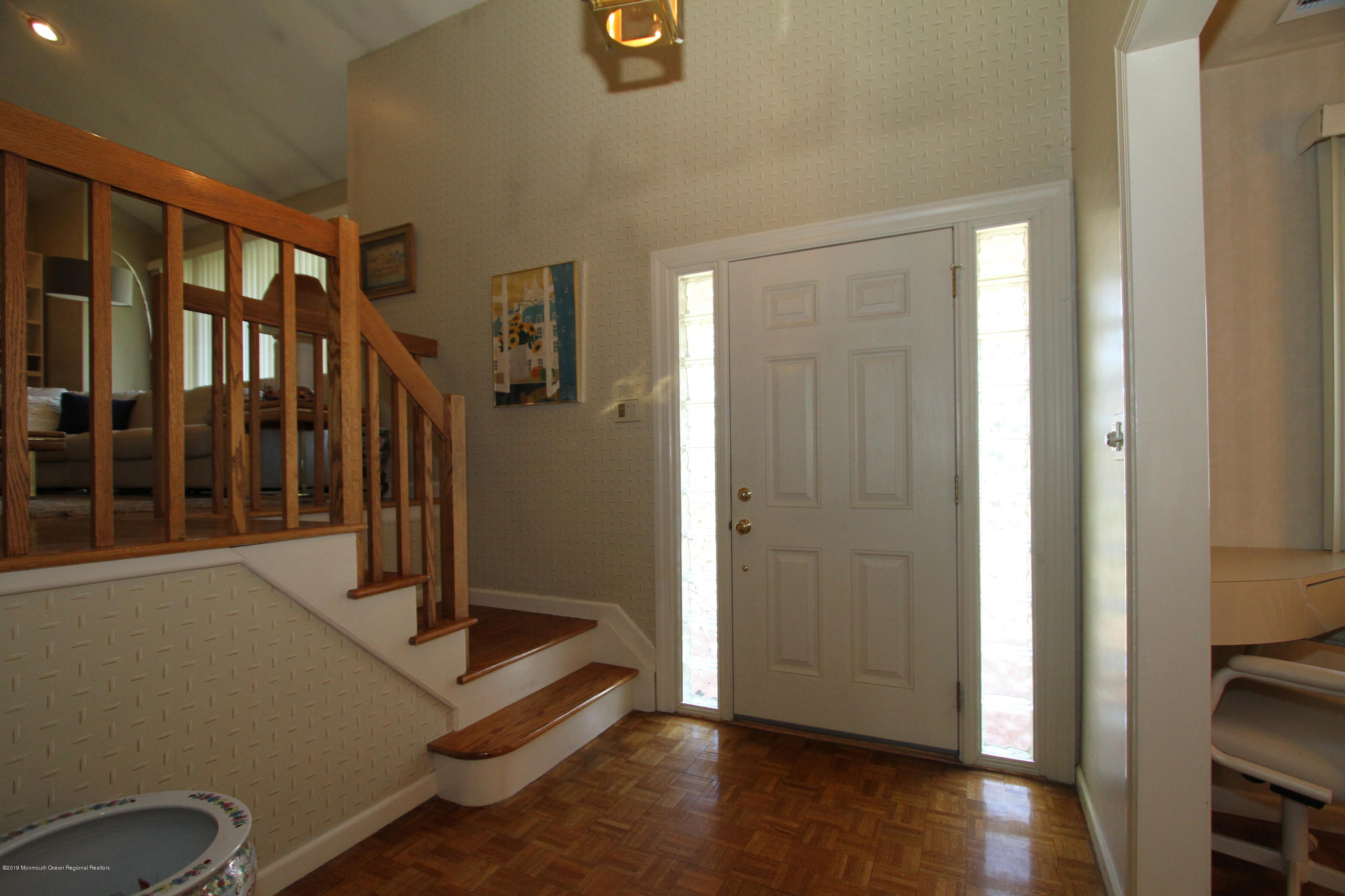 3 Floyd Wyckoff Road Morganville, NJ 07751 - Photo 3 of 28 a view of a hallway with wooden floor and stairs
