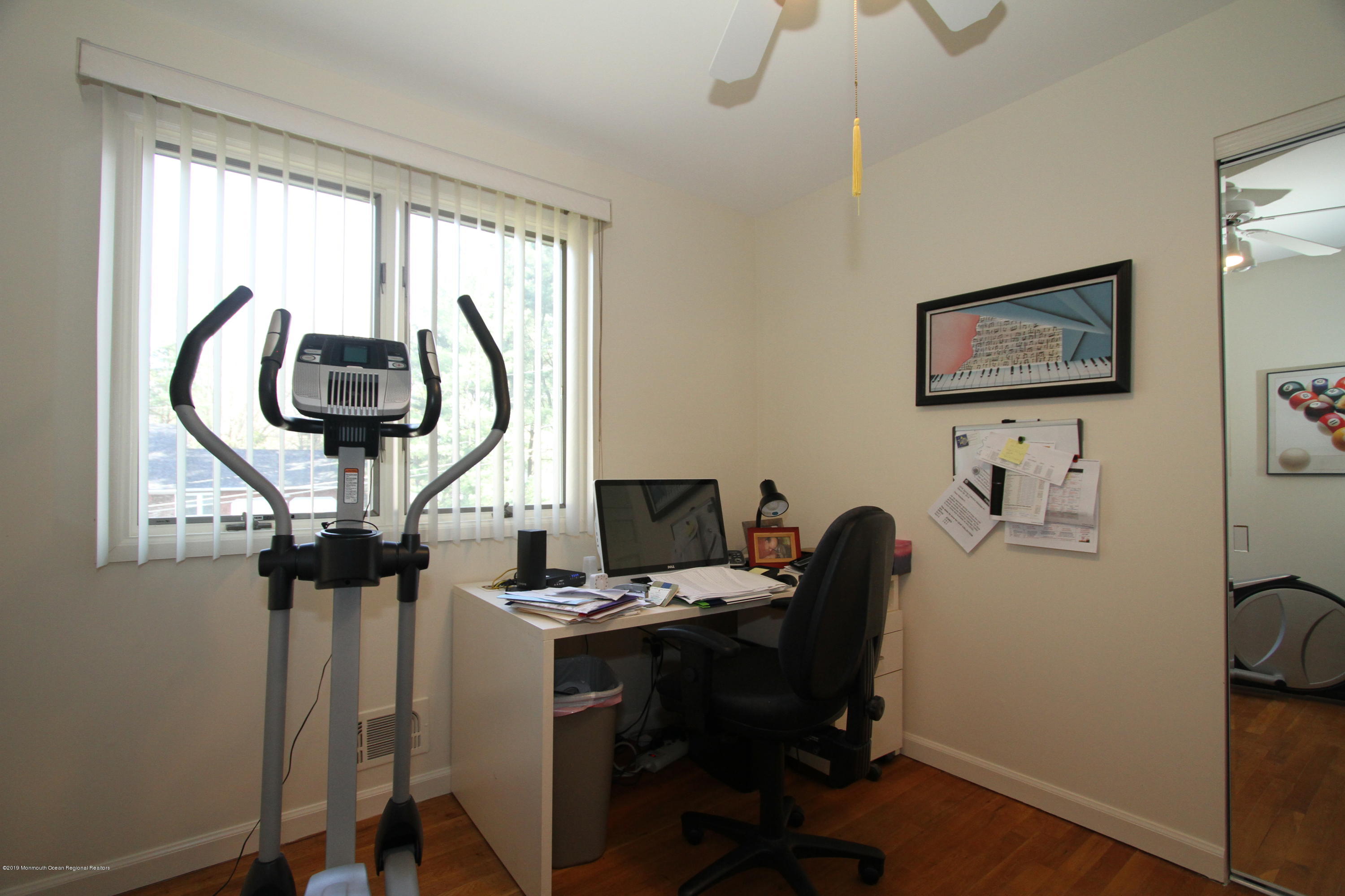 3 Floyd Wyckoff Road Morganville, NJ 07751 - Photo 22 of 28 a room with furniture and a chandelier