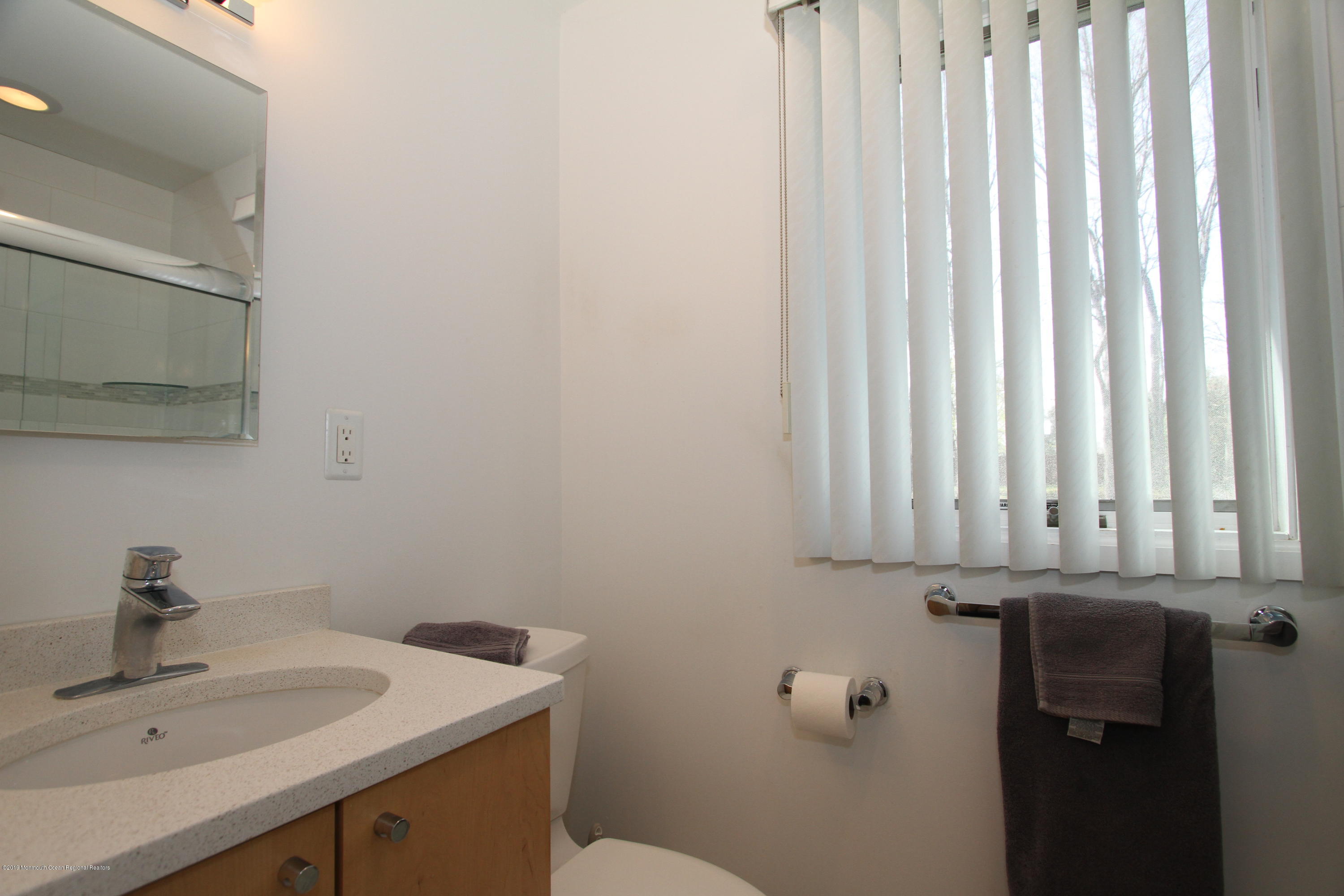 3 Floyd Wyckoff Road Morganville, NJ 07751 - Photo 23 of 28 a bathroom with a sink and a toilet