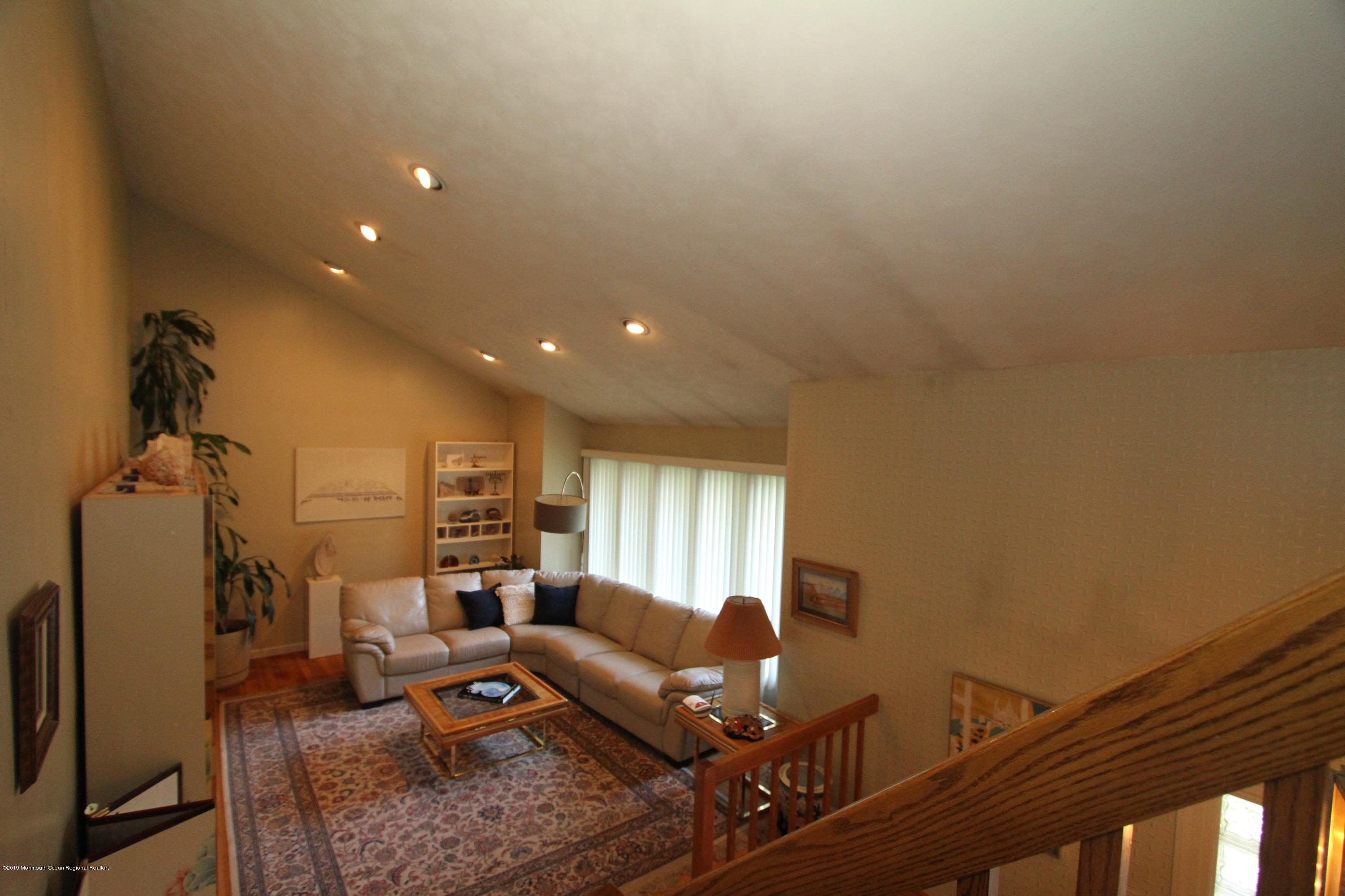 3 Floyd Wyckoff Road Morganville, NJ 07751 - Photo 8 of 28 a living room with furniture and a flat screen tv