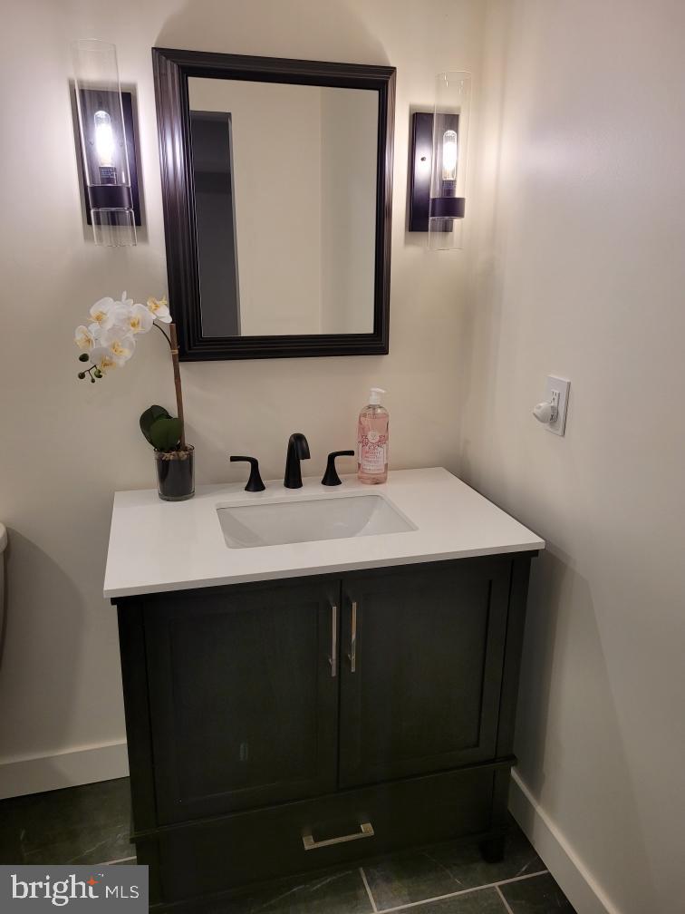 584 Pine Ridge Drive Front Royal, VA 22630 - Photo 12 of 36 NEW Full bath with new lighting and vanity.