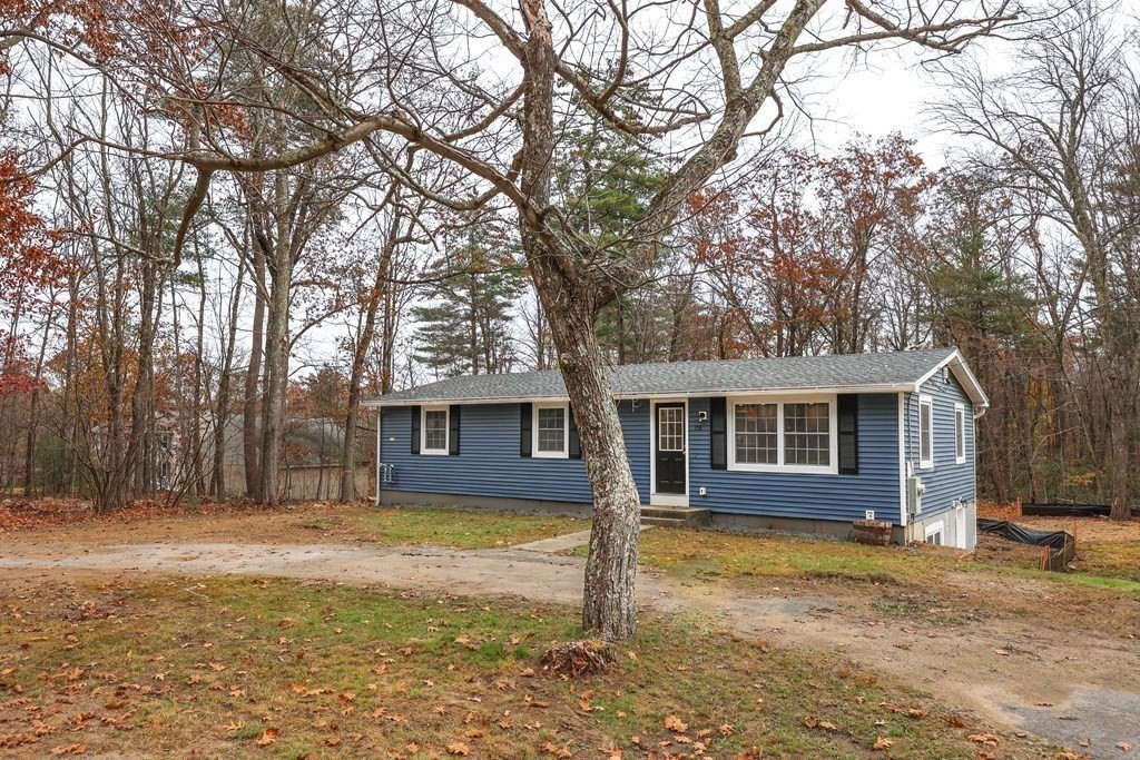 158 Fitchburg Road Townsend, MA 01469 - Photo 4 of 22 front view of a house with a yard