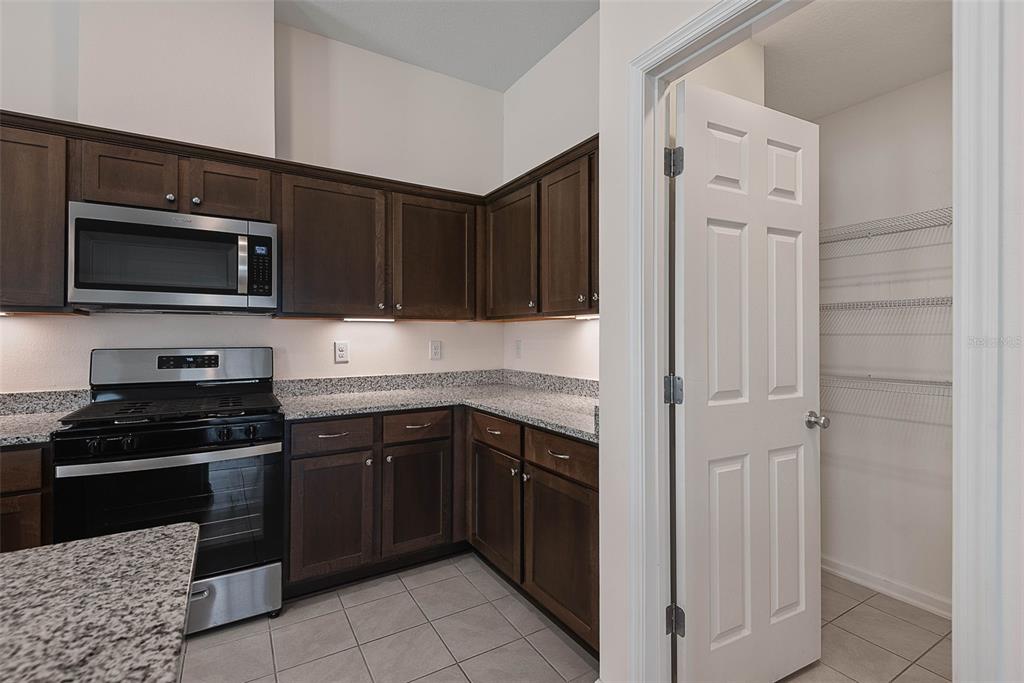 20 Willow Place Palm Coast, FL 32164 - Photo 19 of 61 a kitchen with a sink and steel appliances