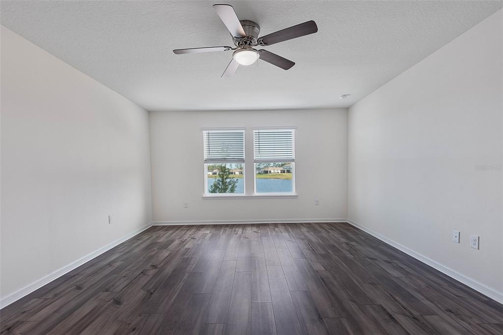 20 Willow Place Palm Coast, FL 32164 - Photo 21 of 61 wooden floor in an empty room with a window