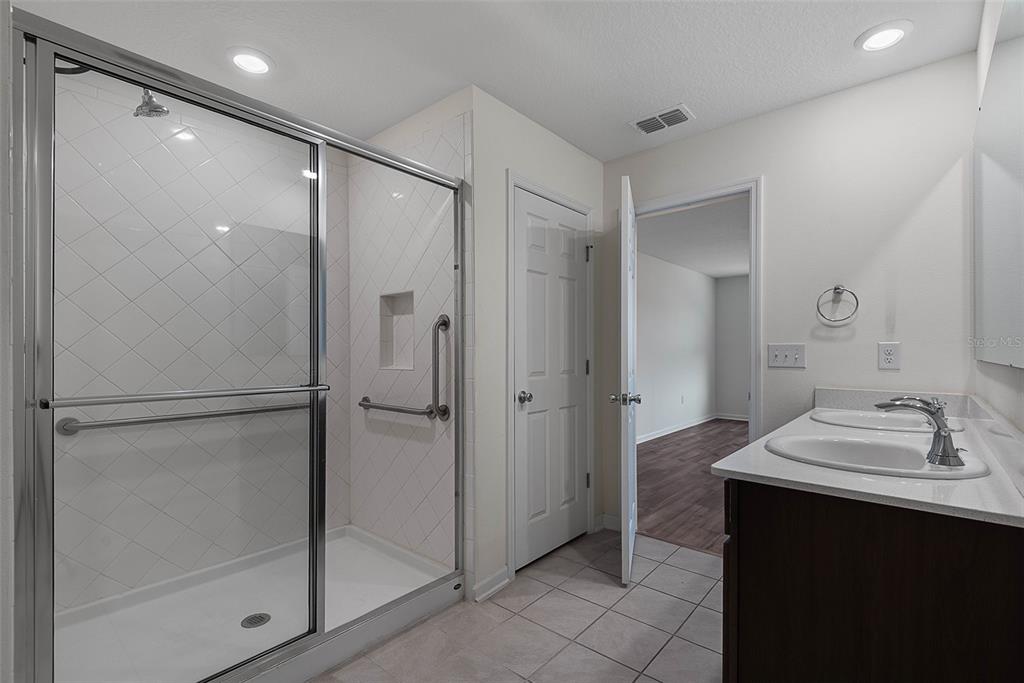 20 Willow Place Palm Coast, FL 32164 - Photo 26 of 61 a bathroom with a sink and a mirror