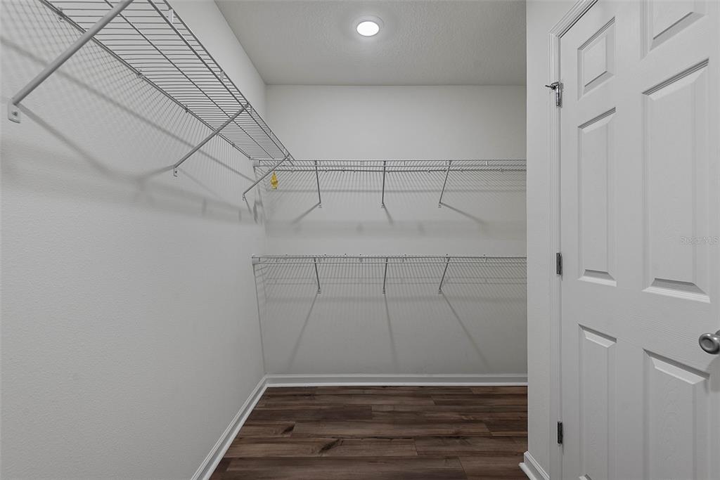 20 Willow Place Palm Coast, FL 32164 - Photo 27 of 61 a view of walk in closet with empty racks