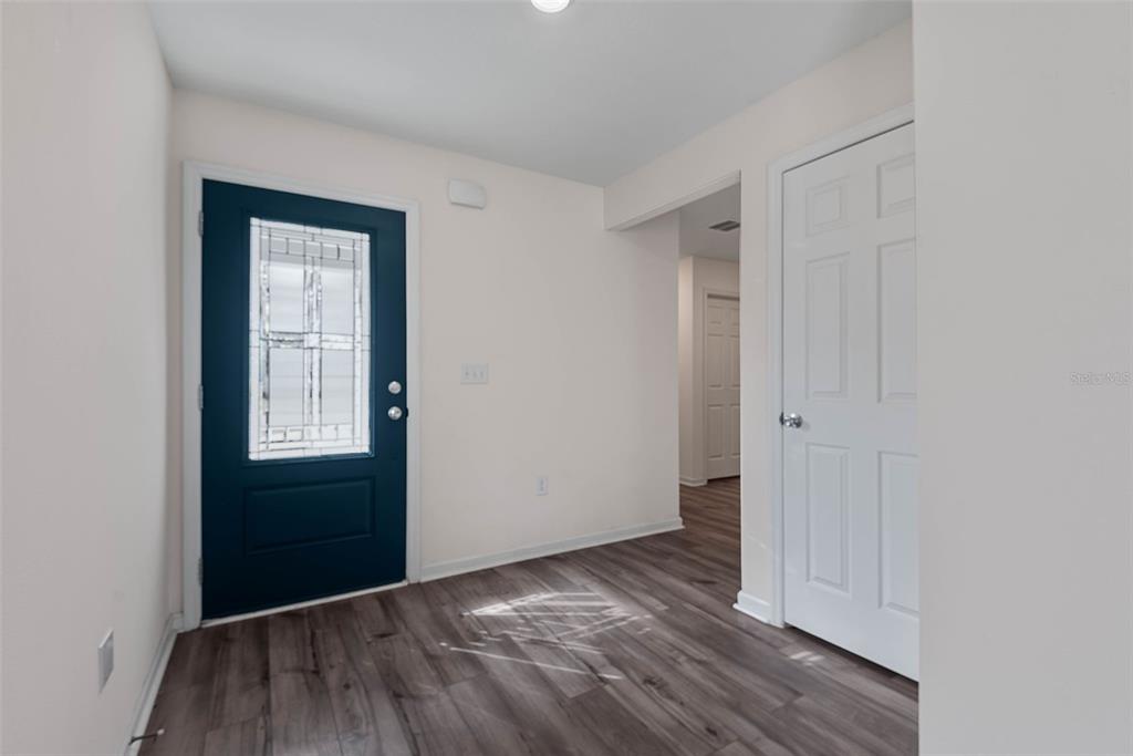 20 Willow Place Palm Coast, FL 32164 - Photo 28 of 61 a view of an empty room with closet and wooden floor
