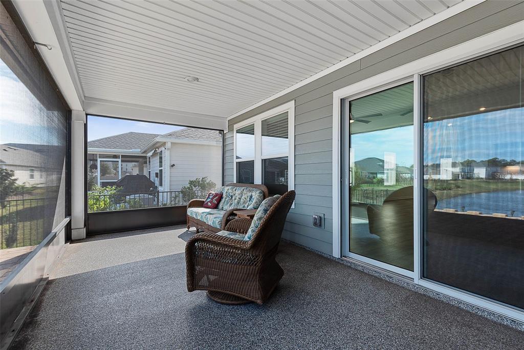 20 Willow Place Palm Coast, FL 32164 - Photo 43 of 61 a living room with furniture and a floor to ceiling window