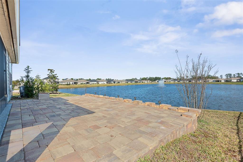 20 Willow Place Palm Coast, FL 32164 - Photo 45 of 61 a view of swimming pool and lake in back