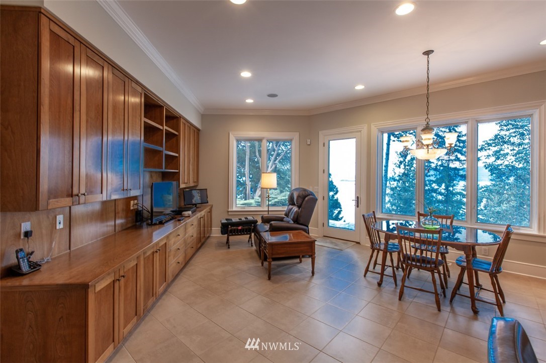 1334 Chuckanut Crest Drive Bellingham, WA 98229 - Photo 19 of 40 a living room with furniture dining table and a large window