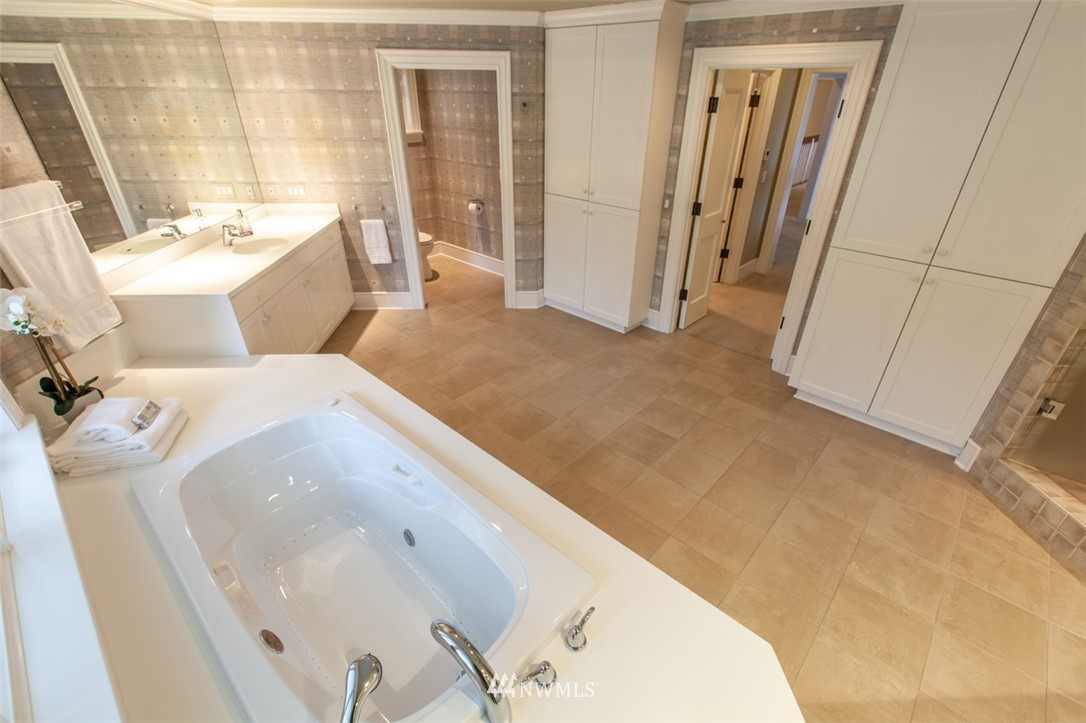 1334 Chuckanut Crest Drive Bellingham, WA 98229 - Photo 30 of 40 a bathroom with a sink and mirror with bathtub