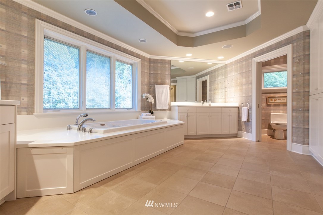 1334 Chuckanut Crest Drive Bellingham, WA 98229 - Photo 31 of 40 a spacious bathroom with a tub sink and mirror