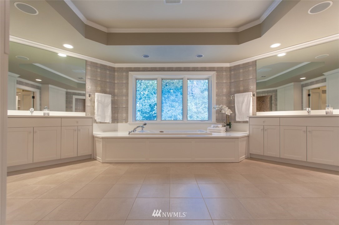 1334 Chuckanut Crest Drive Bellingham, WA 98229 - Photo 33 of 40 a spacious bathroom with a tub sink and mirror