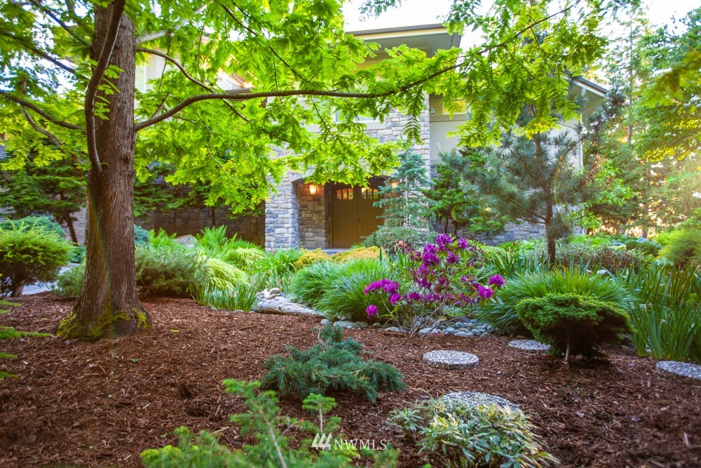 1334 Chuckanut Crest Drive Bellingham, WA 98229 - Photo 5 of 40 a view of a garden with flowers and trees