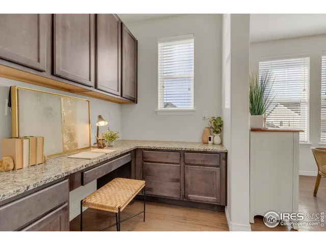 a kitchen with a sink cabinets and window