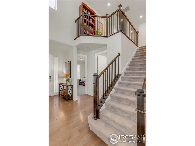 a bedroom with a bed and a television