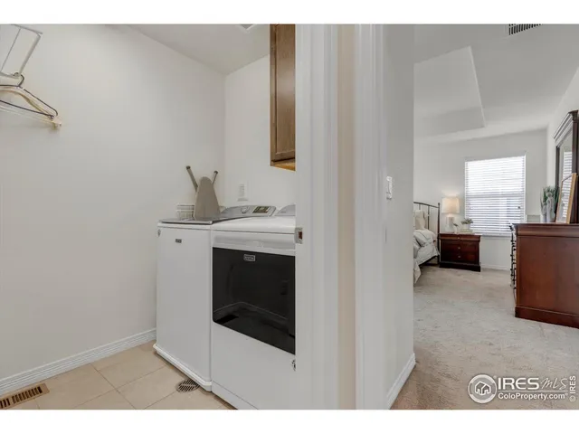 a bedroom with a bed and a night stand