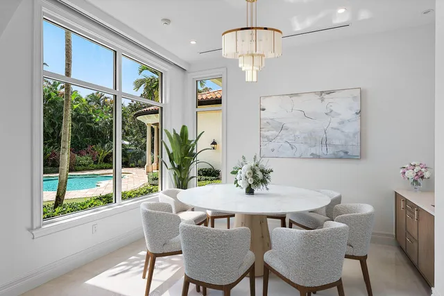 a view of a bedroom with wooden floor and a window
