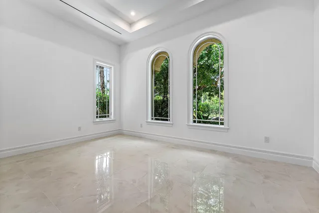 a view of house with backyard and a garden