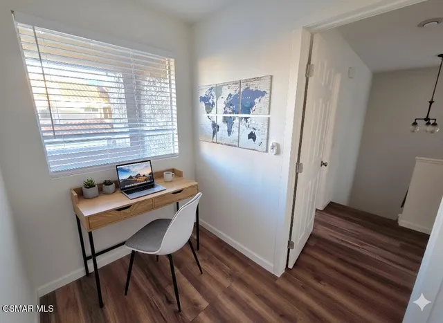 a room with furniture and a window