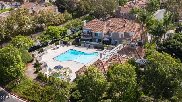 an aerial view of a house with garden space and street view