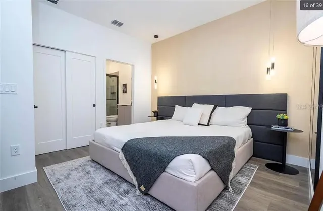 a bedroom with bed and a window