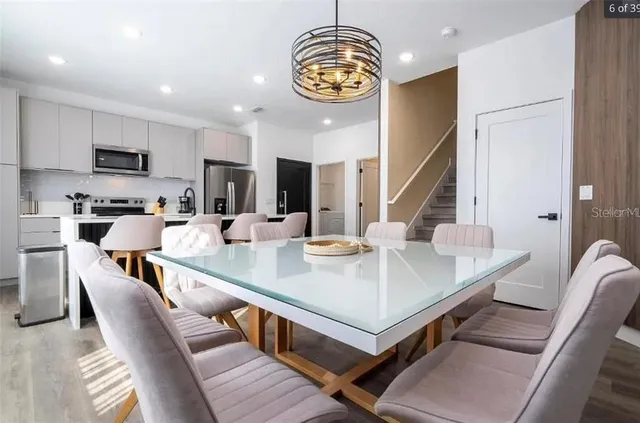 a view of a dining room with furniture window and wooden floor