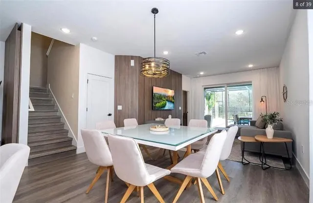 a bedroom with a bed and a wall painting