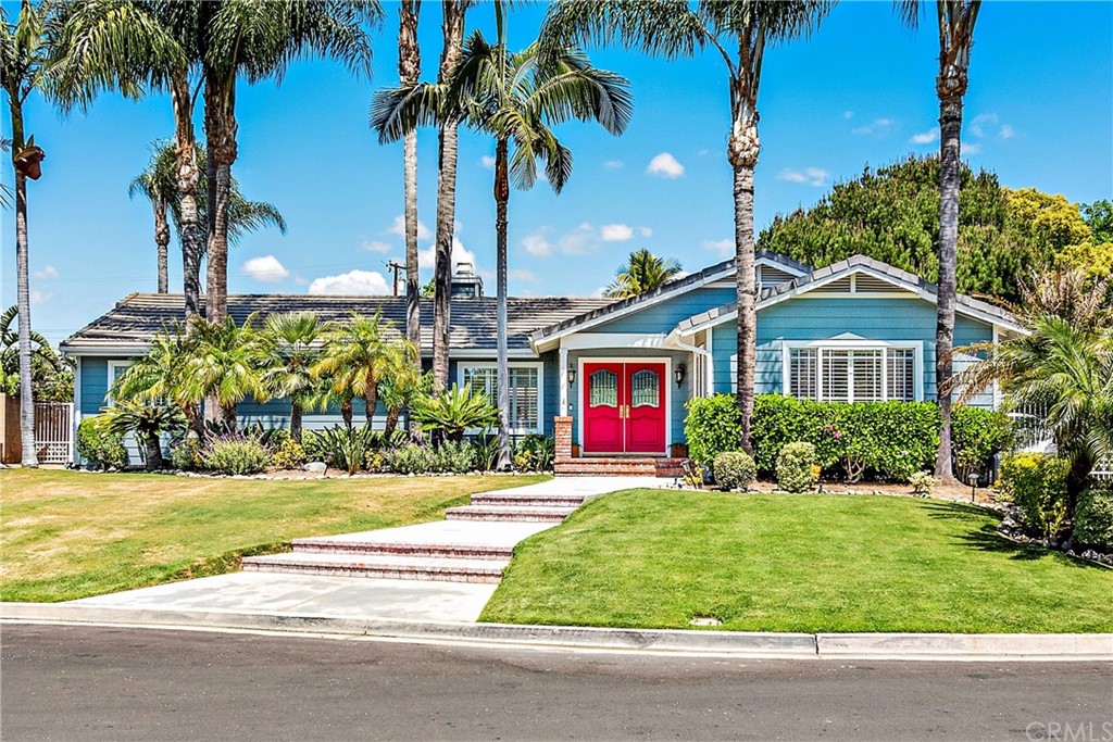 a front view of house with yard and green space