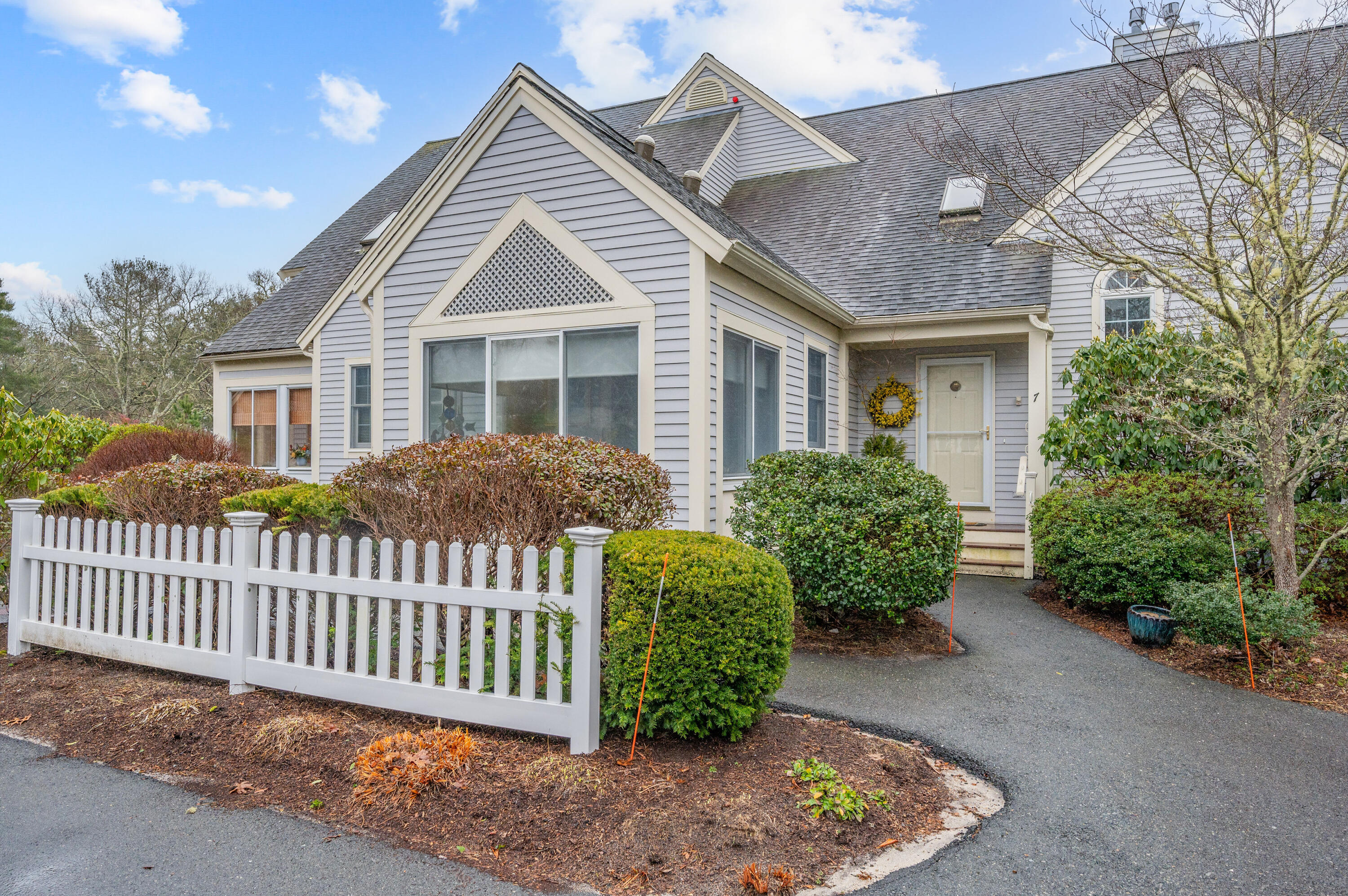 a front view of a house with garden